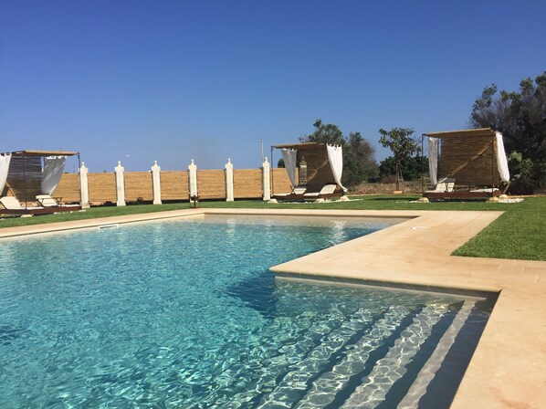 Seasonal outdoor pool, a waterfall pool, free pool cabanas