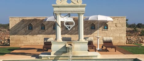 Seasonal outdoor pool, a waterfall pool, free cabanas, pool umbrellas
