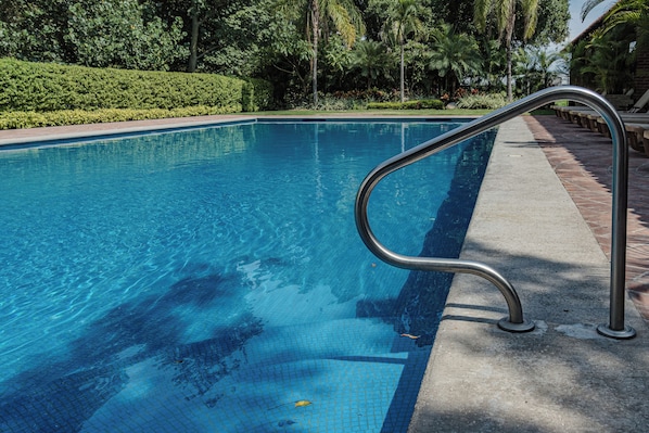 2 outdoor pools, open 8:00 AM to 8:00 PM, pool umbrellas, pool loungers