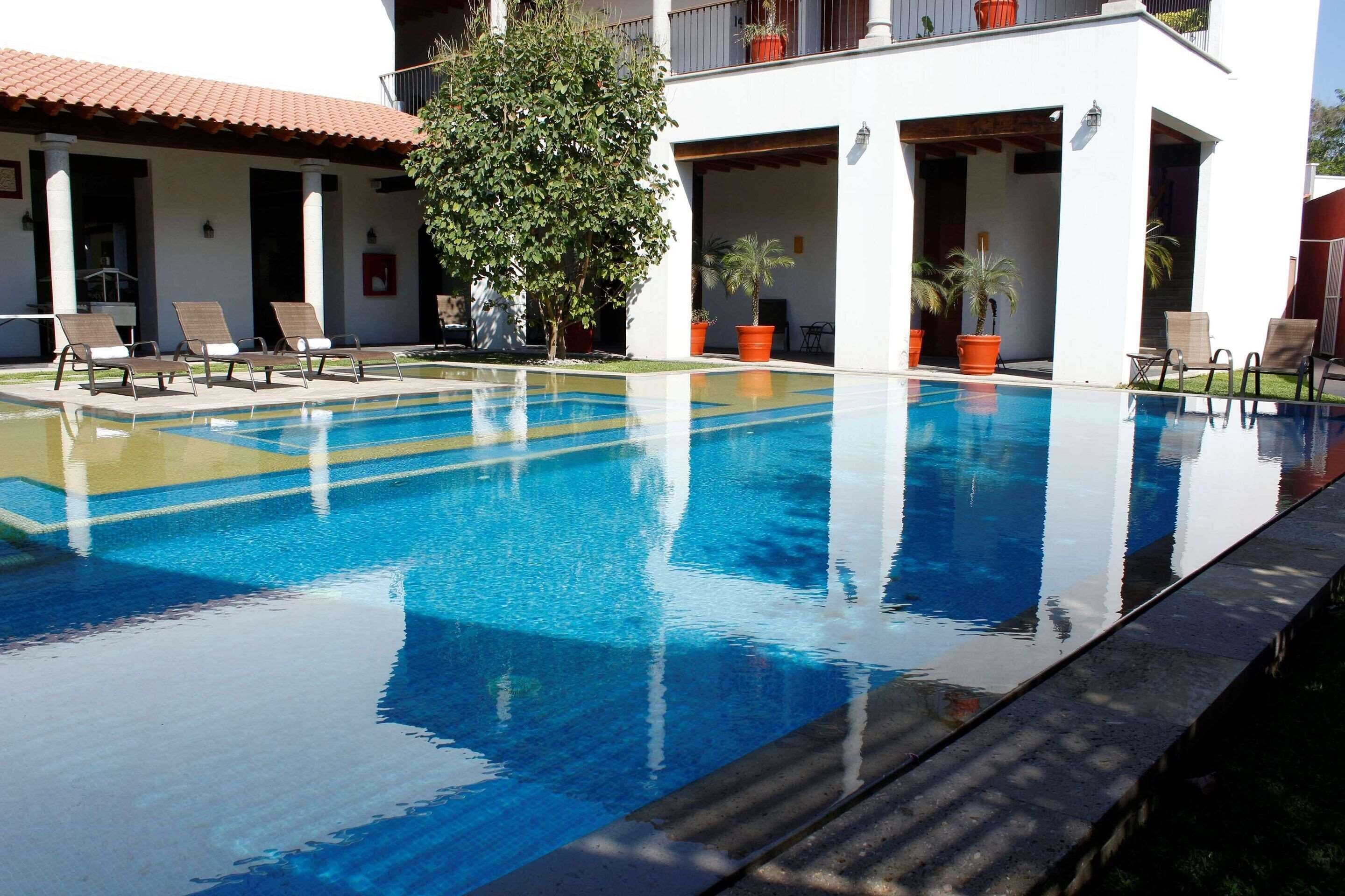 2 outdoor pools, open 8:00 am to 8:00 pm, pool umbrellas, pool loungers