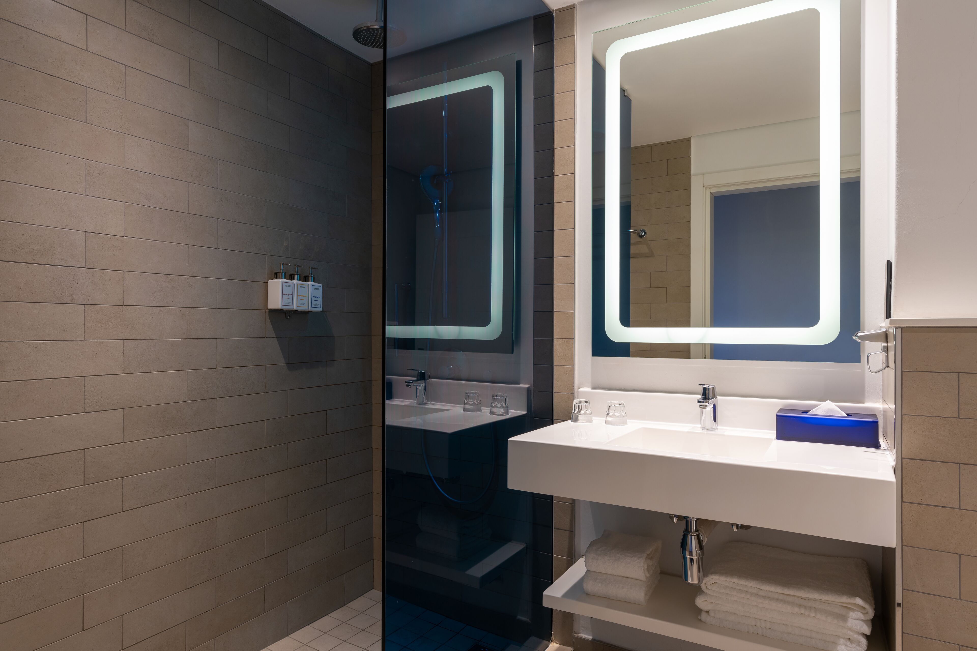 standard room (pool facing) | bathroom | combined shower/bathtub, designer toiletries, hair dryer, towels