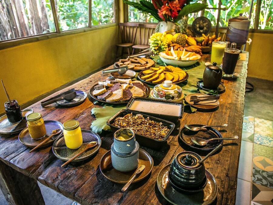 A breakfast buffet with various food items and beverages.