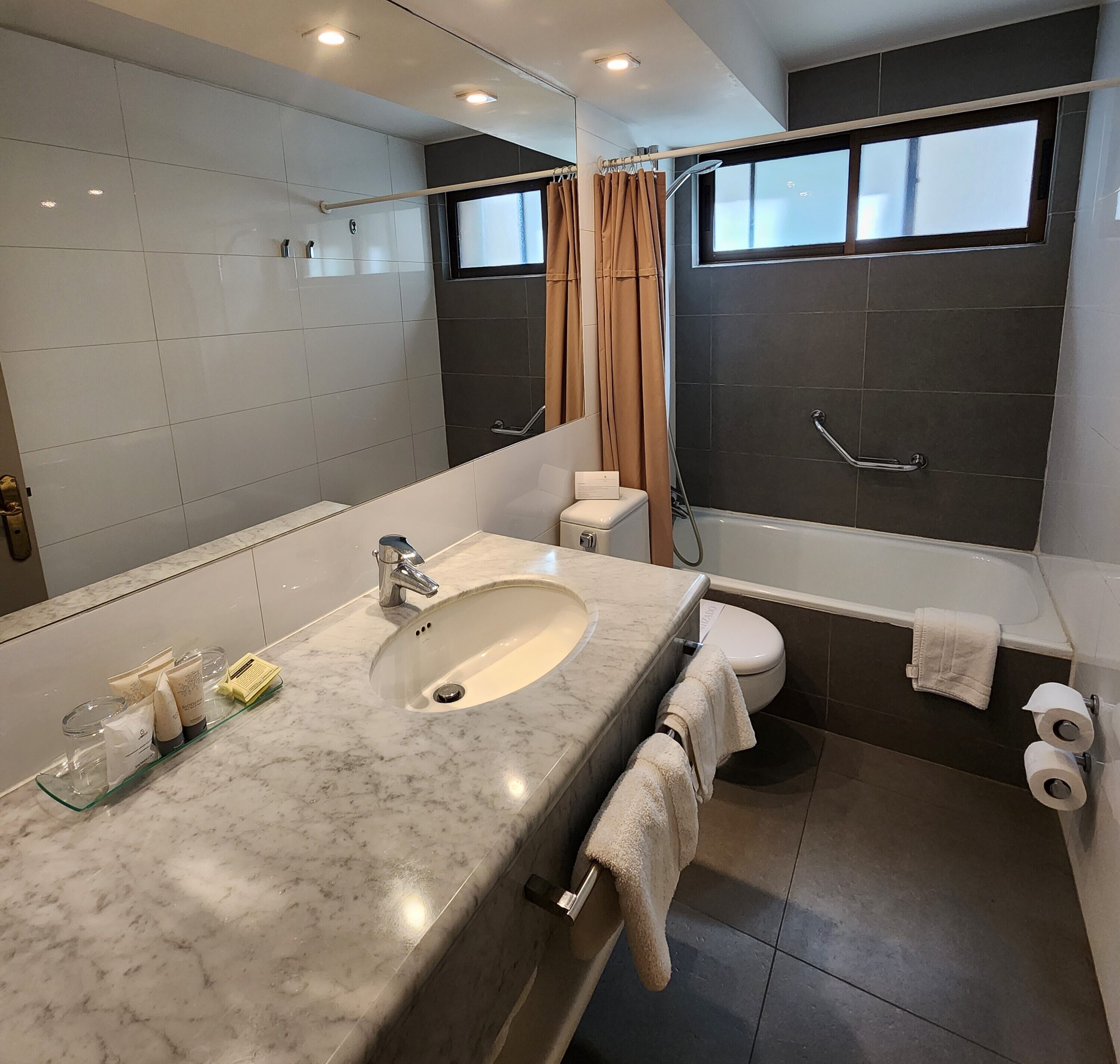 superior room | bathroom | shower, rainfall showerhead, free toiletries, hair dryer