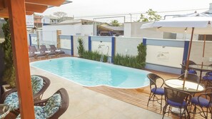 Outdoor pool, open 9:30 AM to 9:00 PM, pool umbrellas, pool loungers