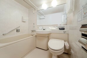Combined shower/tub, free toiletries, hair dryer, slippers