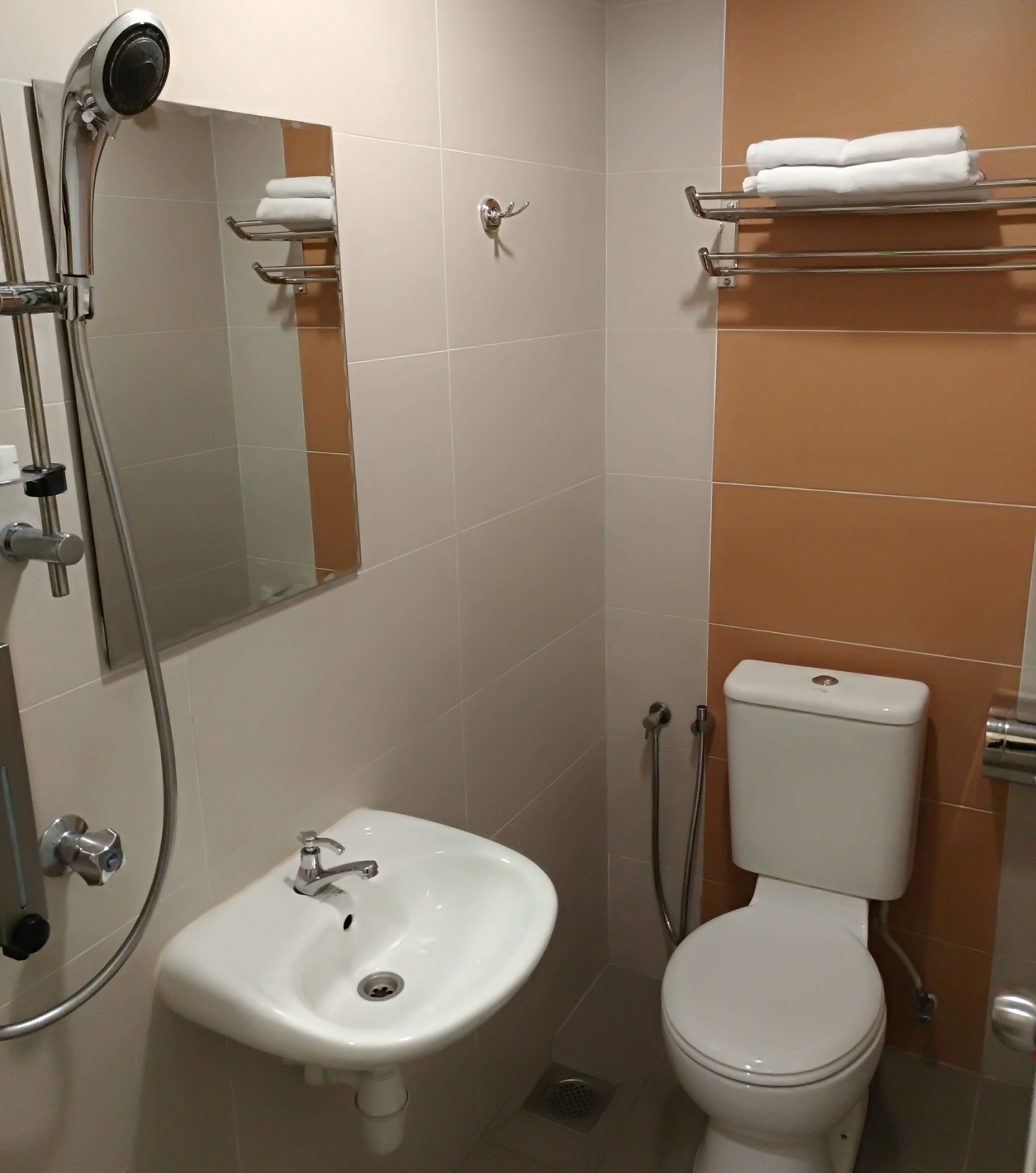 deluxe room (with window) | bathroom | shower, free toiletries, hair dryer, slippers