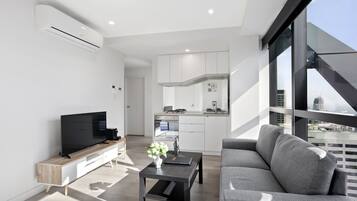 Superior Two Bedroom Apartment | Living area | Flat-screen TV