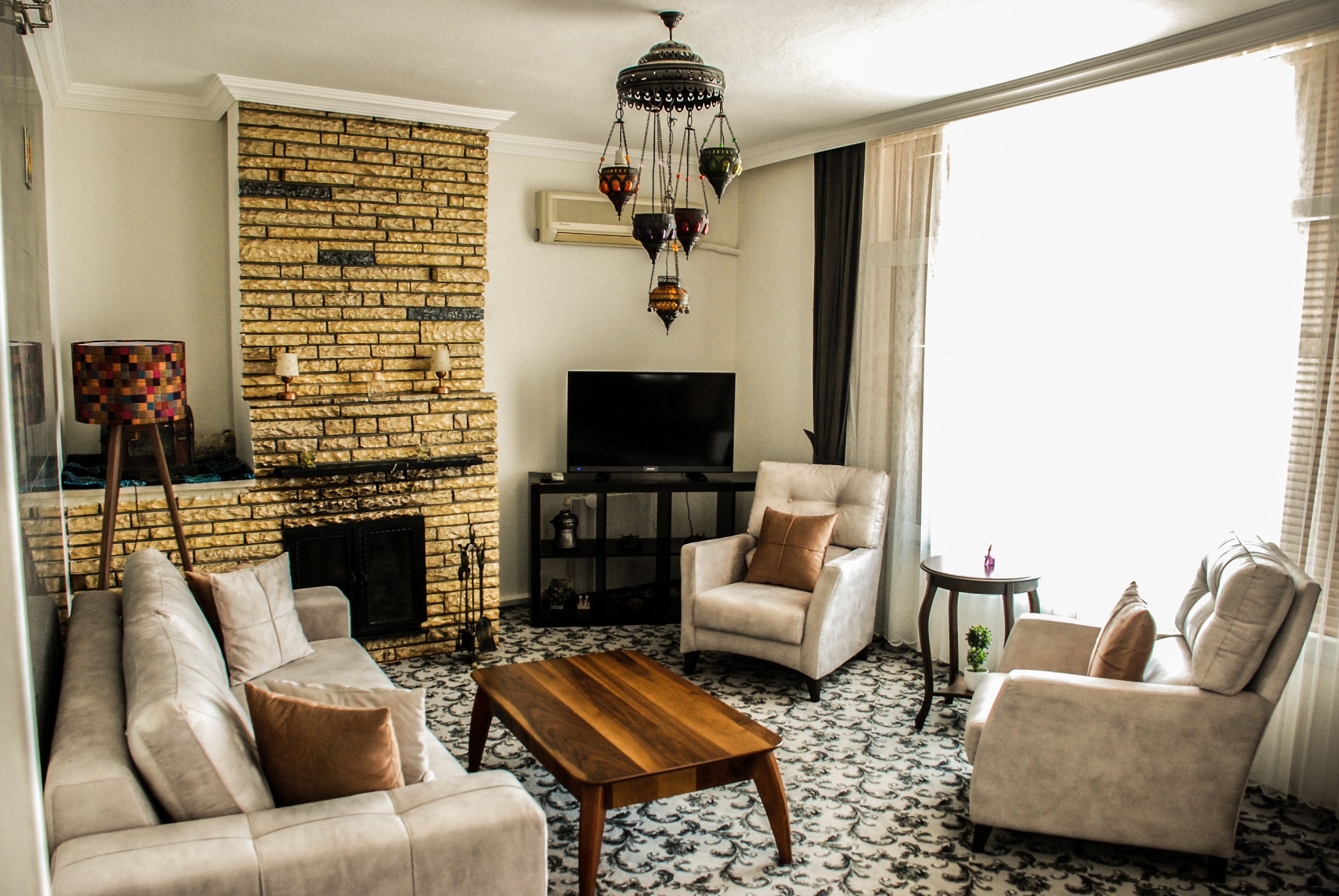 exclusive suite, 2 bedrooms, sea view, beachfront | living room | flat-screen tv