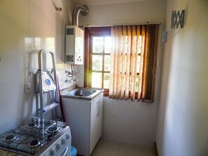 Apartment, 2 Bedrooms | Private kitchen | Fridge, microwave, oven, stovetop - Gramado Golden Apartamento (Gramado)