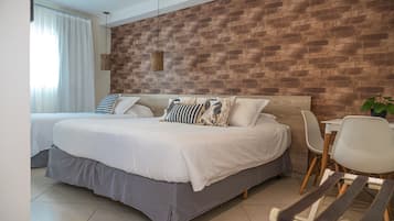 Deluxe Suite | Minibar, in-room safe, blackout drapes, free WiFi