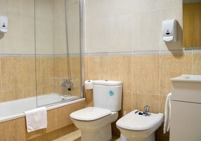 Hair dryer, bidet, towels, toilet paper