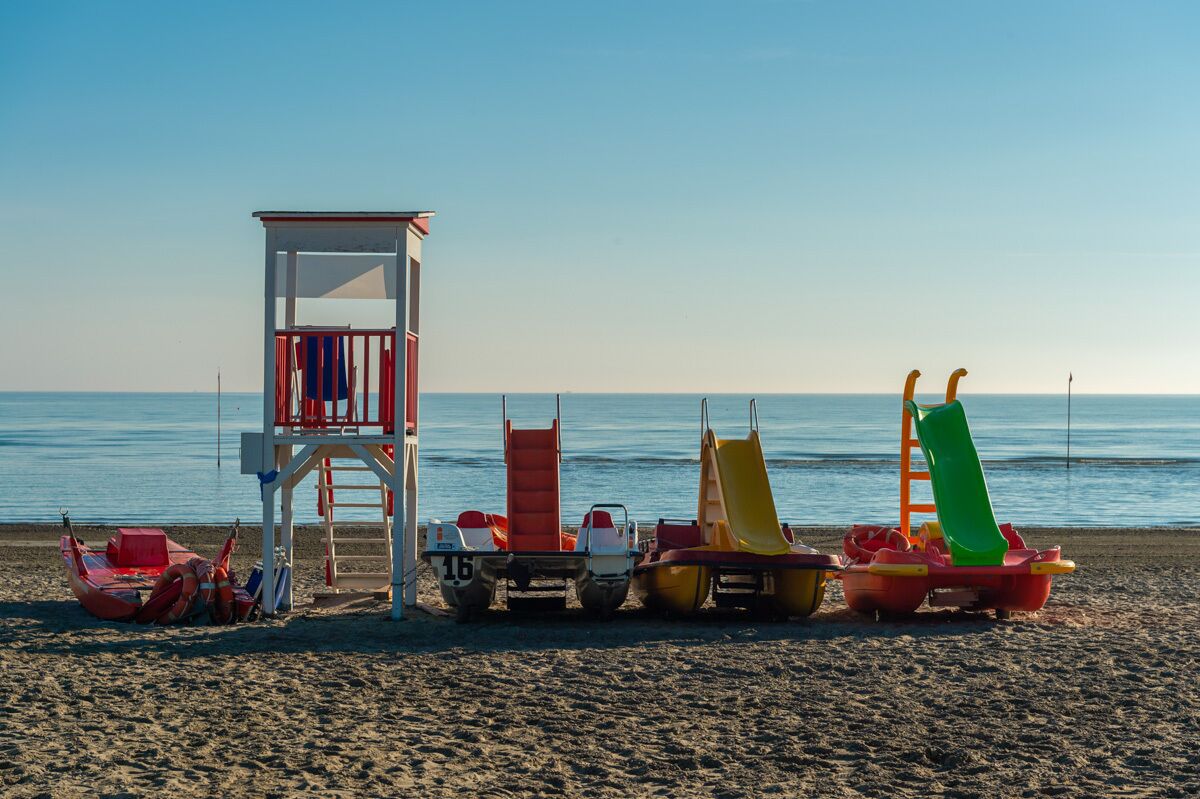 sun-loungers, beach umbrellas, beach yoga, beach volleyball