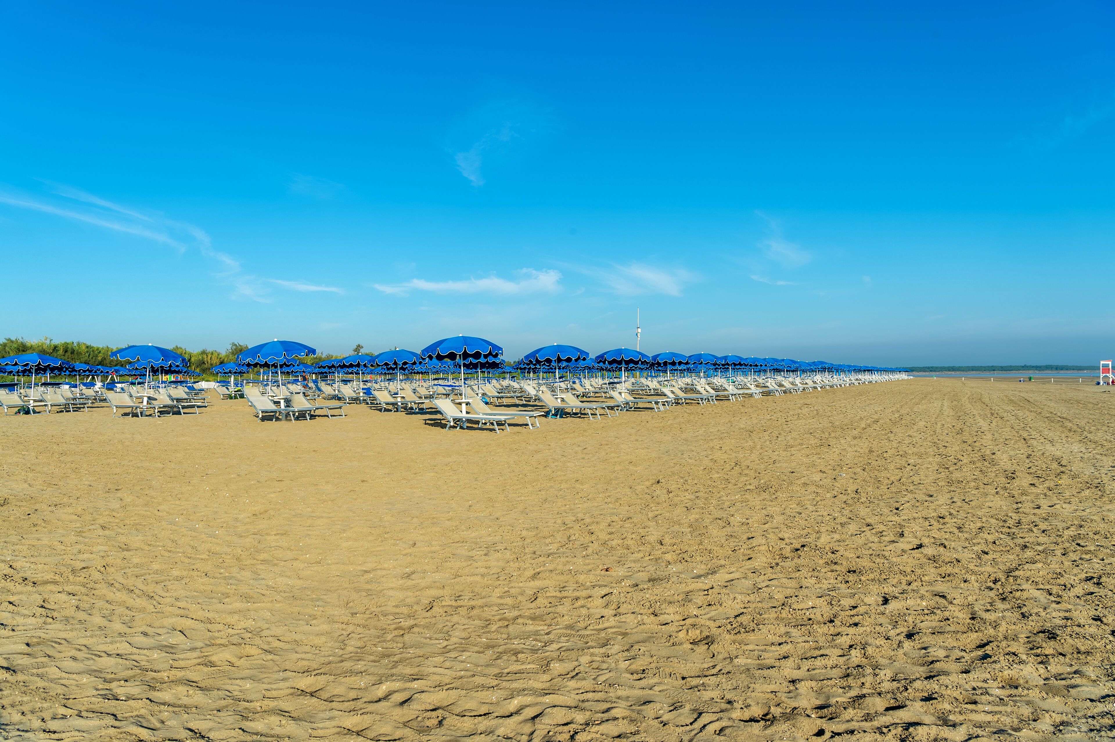 sun-loungers, beach umbrellas, beach yoga, beach volleyball