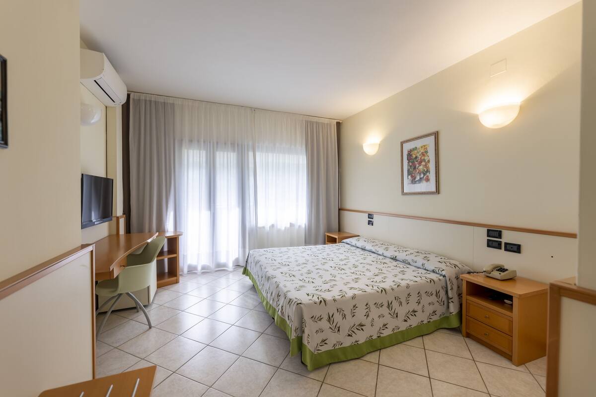 Minibar, desk, blackout curtains, bed sheets