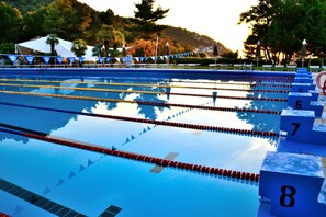 Seasonal outdoor pool, pool umbrellas, pool loungers