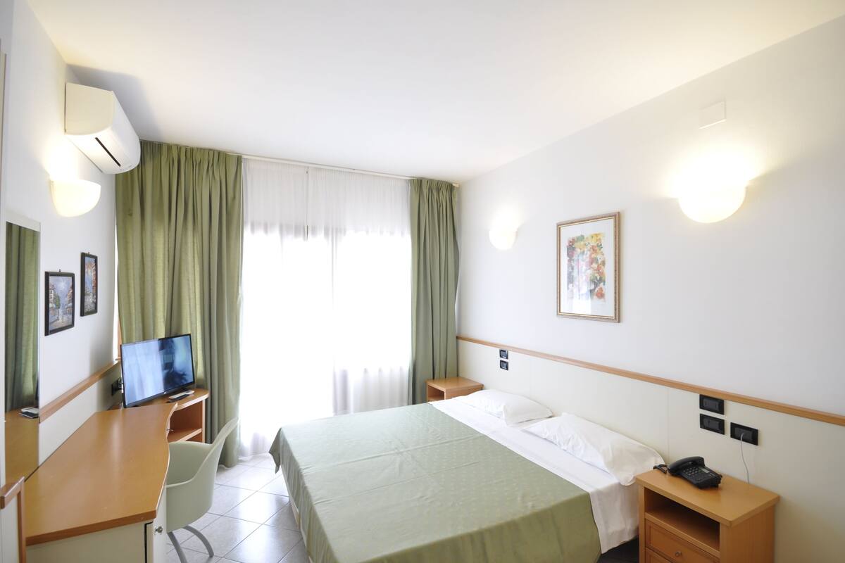 Minibar, desk, blackout curtains, bed sheets