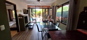 Family Apartment, 2 Bedrooms, Terrace, Poolside | Living area | 32-inch flat-screen TV with cable channels, TV - Apartamentos Massai (Cabo Velas)