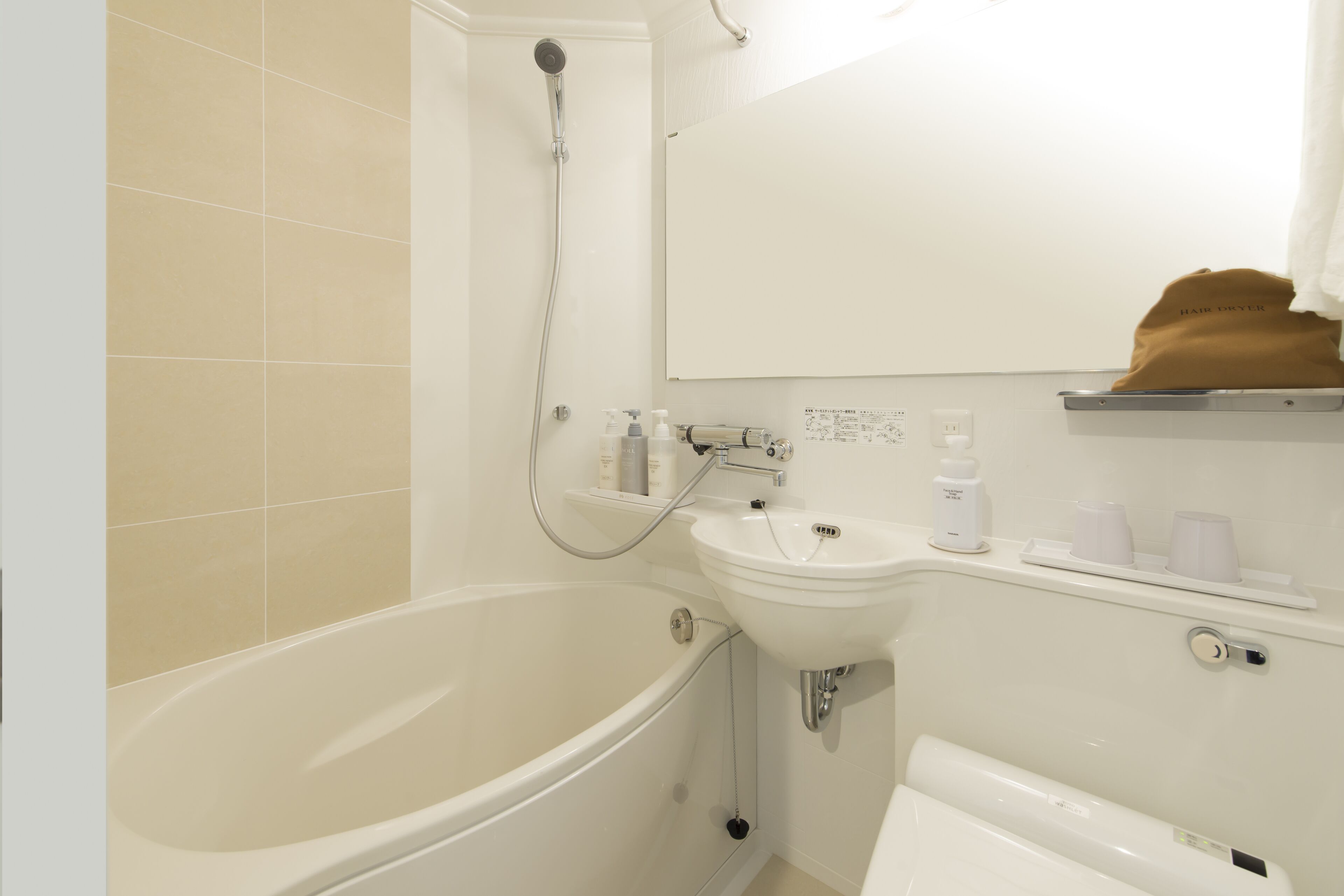 combined shower/bathtub, free toiletries, hair dryer, slippers