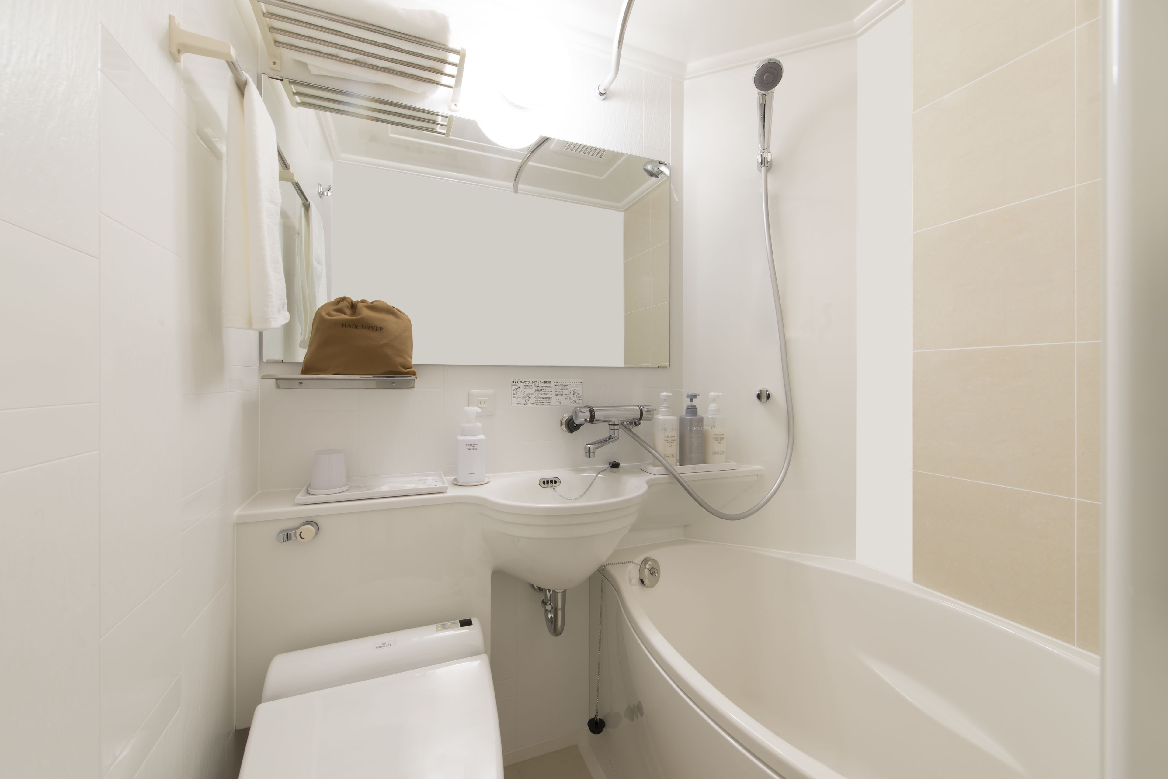combined shower/bathtub, free toiletries, hair dryer, slippers
