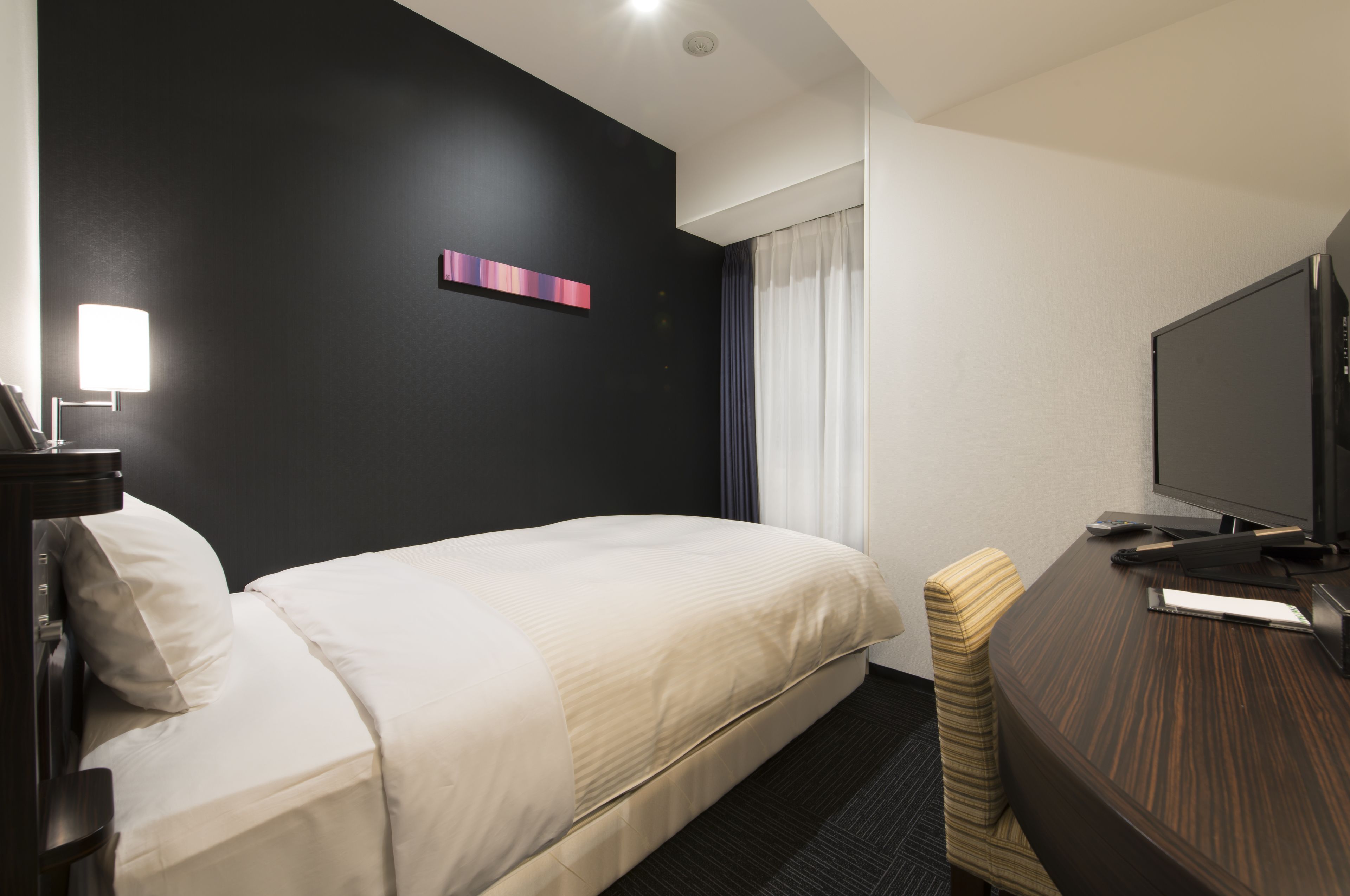 down duvets, pillow-top beds, in-room safe, desk