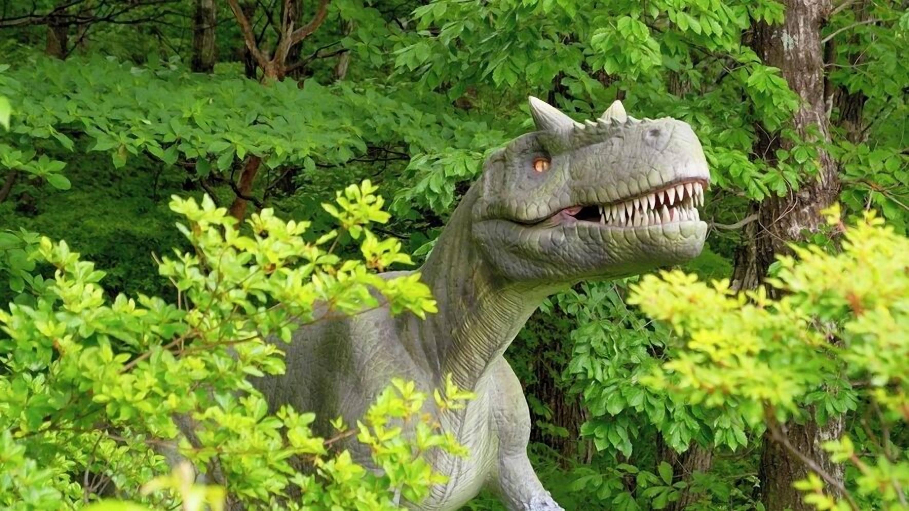 A dinosaur statue surrounded by lush green foliage.