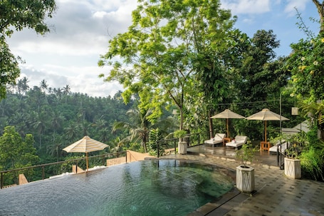 Outdoor pool, open 7:00 AM to 10:00 PM, pool umbrellas, sun loungers