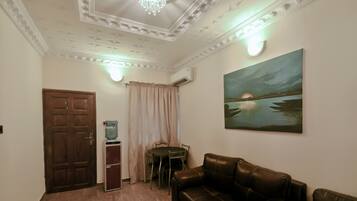 Apartment, 2 Bedrooms | Living area | 30-inch flat-screen TV with cable channels, TV