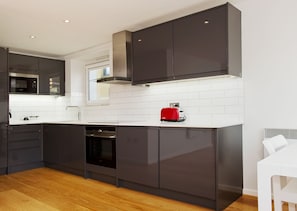 Deluxe Apartment, 2 Bedrooms (12) | Private kitchen | Full-sized fridge, microwave, oven, stovetop