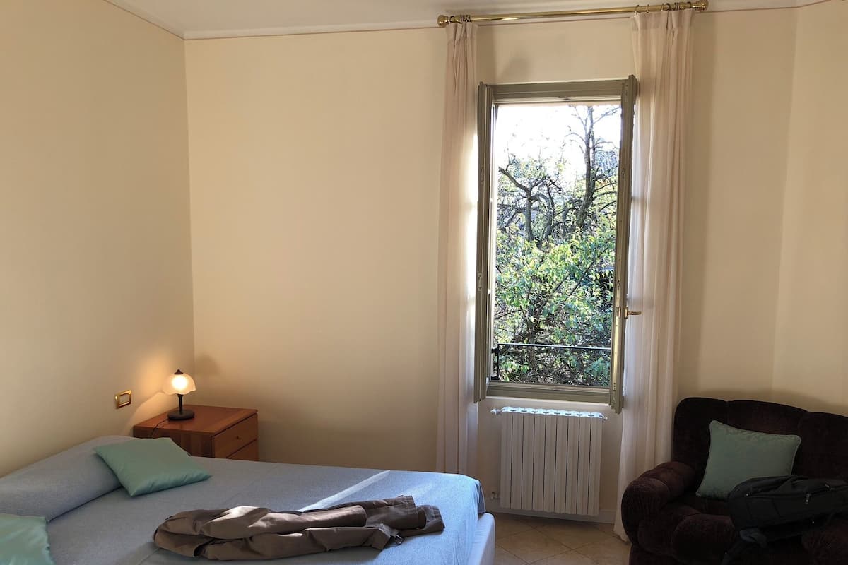 Down duvets, desk, laptop workspace, blackout curtains