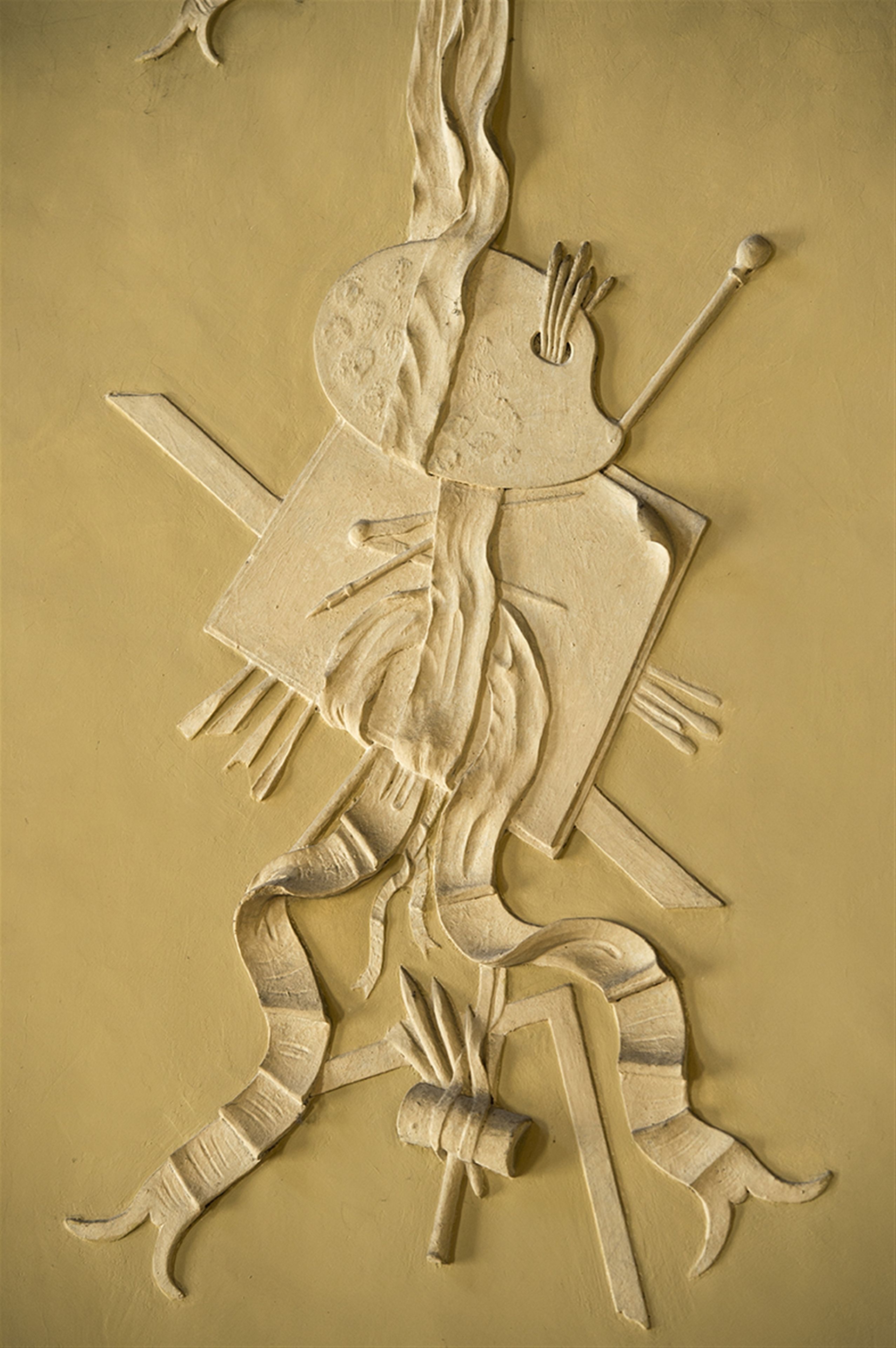 A sculpture of a figure with a sword and shield.