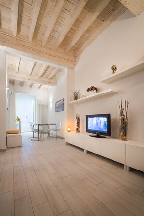 Apartment, 1 Bedroom (Via Benedetta 11) | Living room | 40-inch flat-screen TV with digital channels, TV - Novella Apartments (Florence)