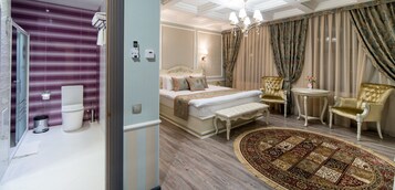 Habitación de hotel con cama, mesita de noche, sillas, alfombra y baño con inodoro y ducha.