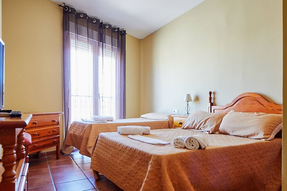 Triple Room | Desk, blackout curtains, free cots/infant beds, rollaway beds