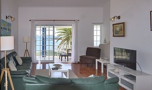 Family Apartment, 2 Bedrooms, Sea View, Beachfront | Living area | 32-inch LED TV with cable channels, TV
