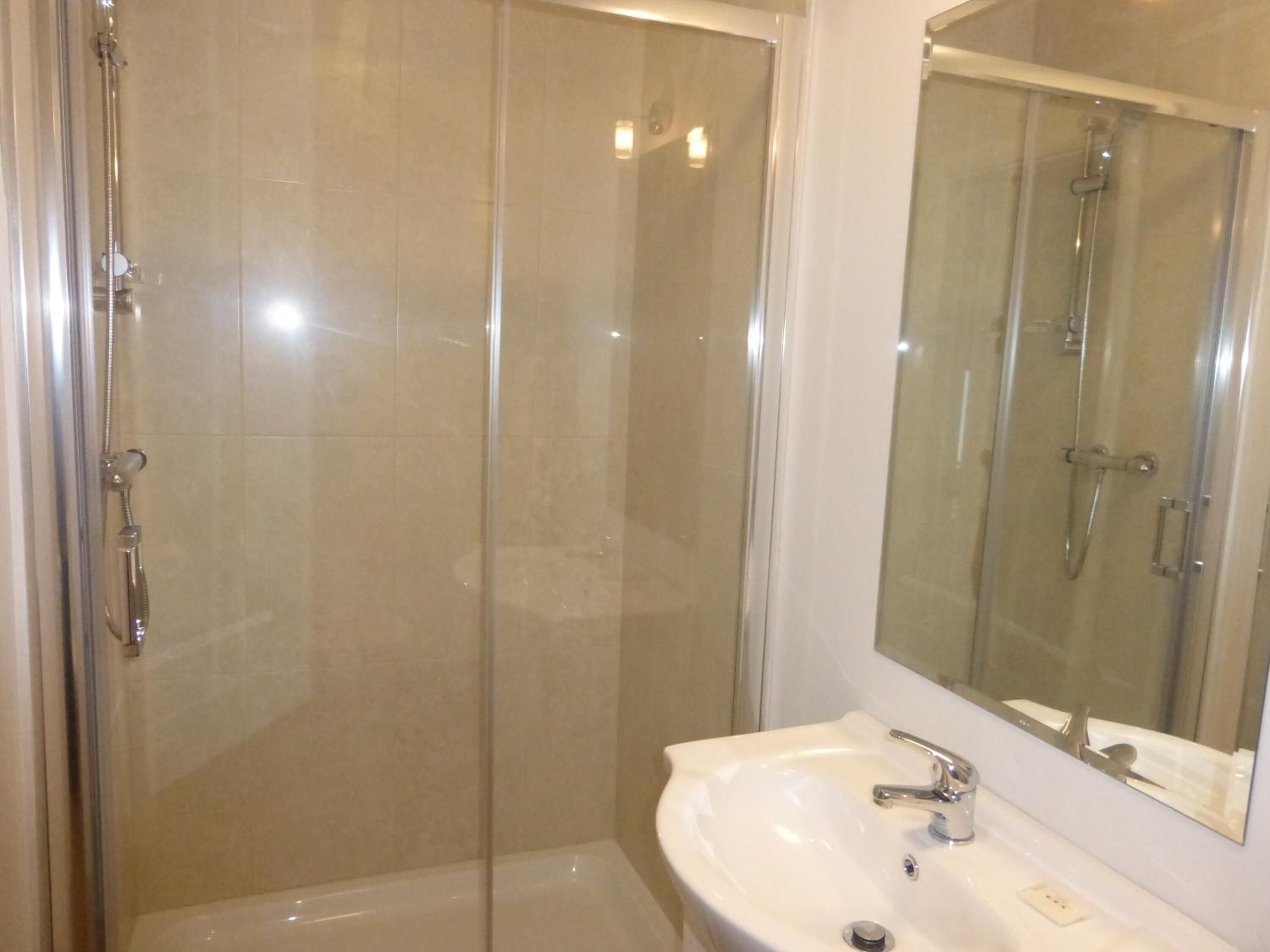 designer toiletries, hair dryer, towels