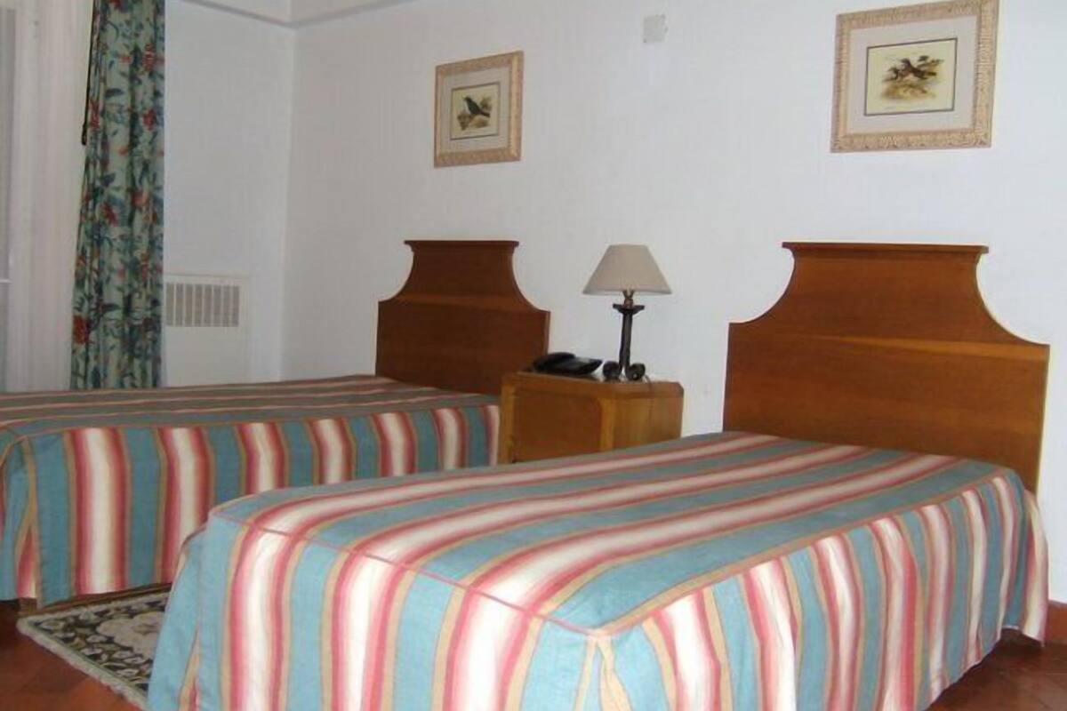 Twin Room | Minibar, desk, blackout curtains, free cots/infant beds