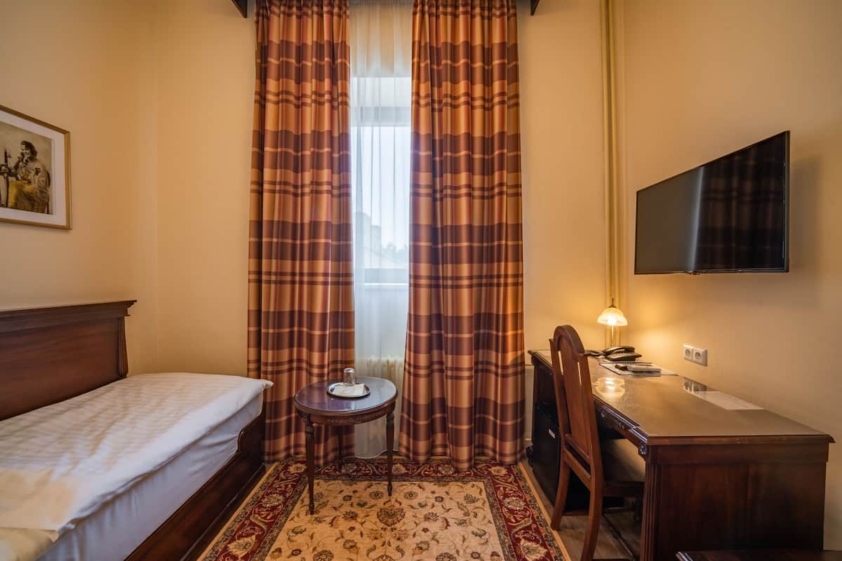 single room (small) | in-room safe, desk, blackout curtains, iron/ironing board