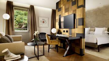 Deluxe Suite | Living area | 50-inch Smart TV with digital channels, TV, Netflix