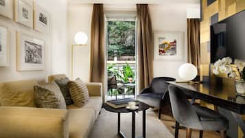 Deluxe Suite | Living area | 50-inch Smart TV with digital channels, TV, Netflix