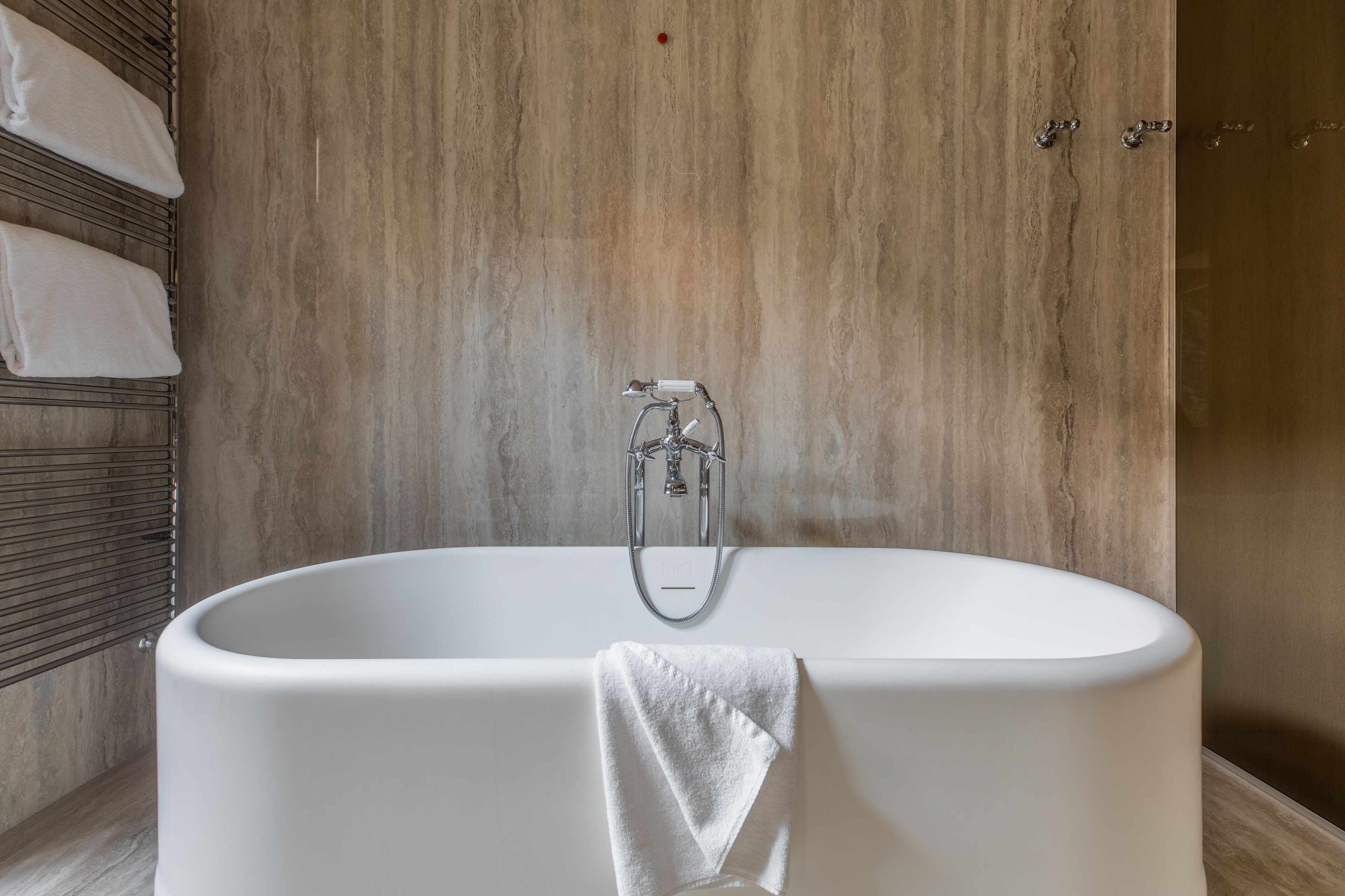 designer toiletries, hair dryer, bathrobes, slippers