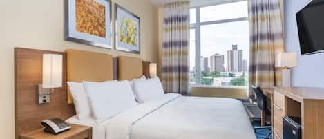 Desk, laptop workspace, blackout drapes, iron/ironing board