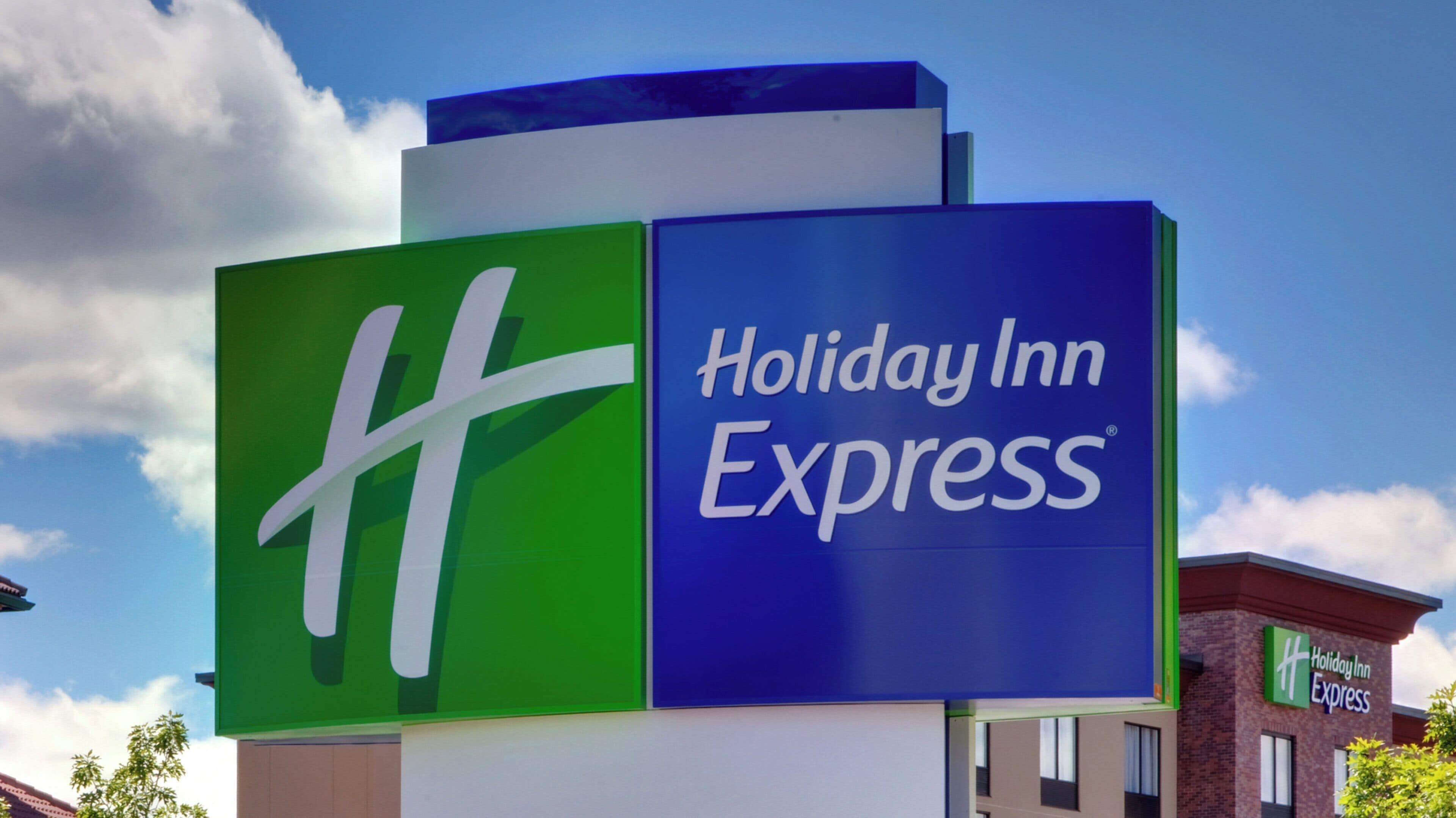 A Holiday Inn Express sign with a prominent 'H' logo.
