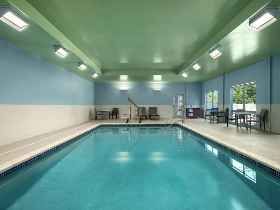 Indoor pool, open 6:00 AM to 10:00 PM, pool loungers