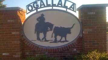 A sign with a silhouette of a cowboy and a dog, with the word 'OGALLALA' above.