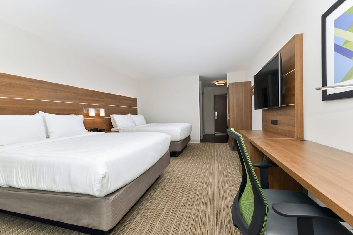 Luxe beddengoed, pillowtop-bedden, een kluis op de kamer