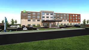 Un bâtiment Holiday Inn Express & Suites doté d’un parking et d’une entrée abritée.