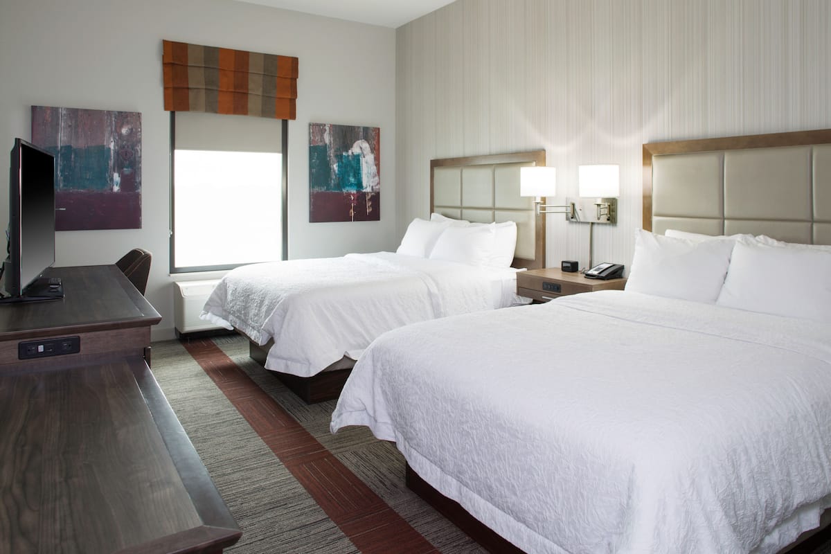 hypo-allergenic bedding, desk, laptop workspace, blackout curtains