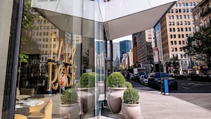 A modern building with large windows and a sign reading "Park Avenue." - Hotel Park Ave NYC (New York)