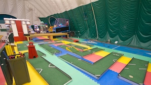 An indoor play area with various play structures and a tent-like enclosure. - Club Wyndham Smugglers’ Notch Vermont  (Jeffersonville)