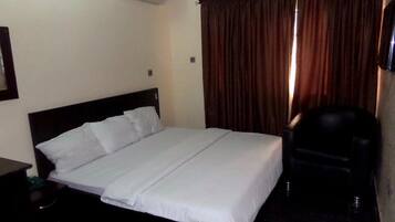 1 bedroom, desk, laptop workspace, bed sheets